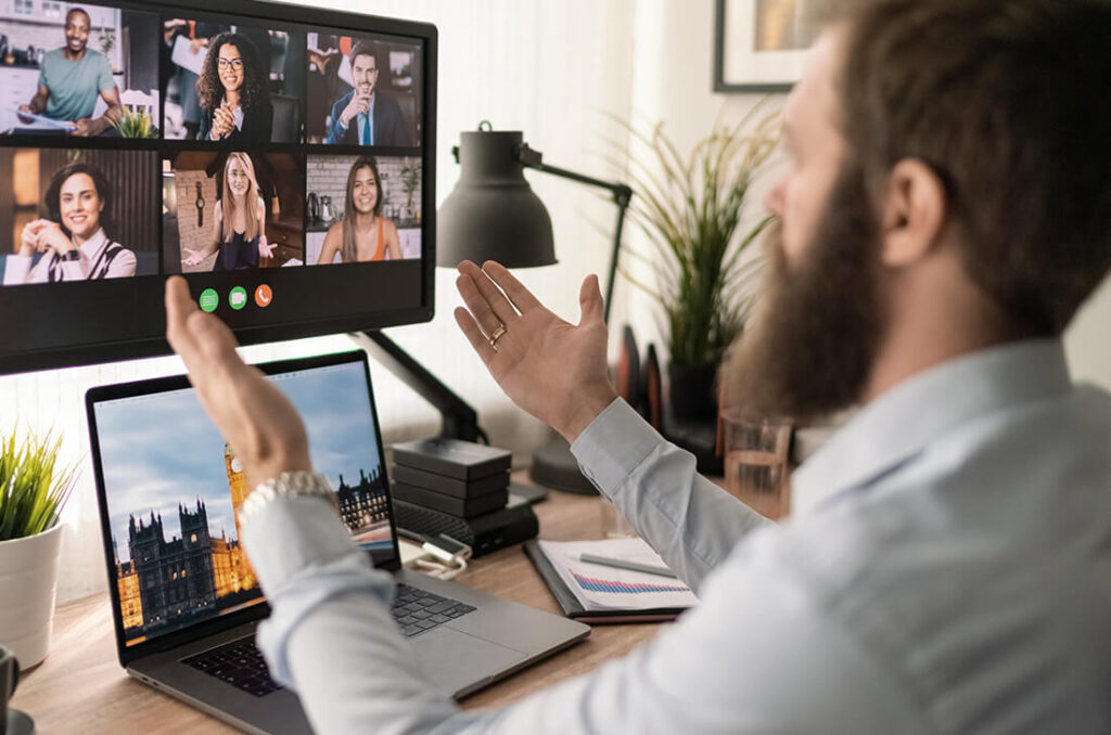 Picture of a person video conferencing with multiple people