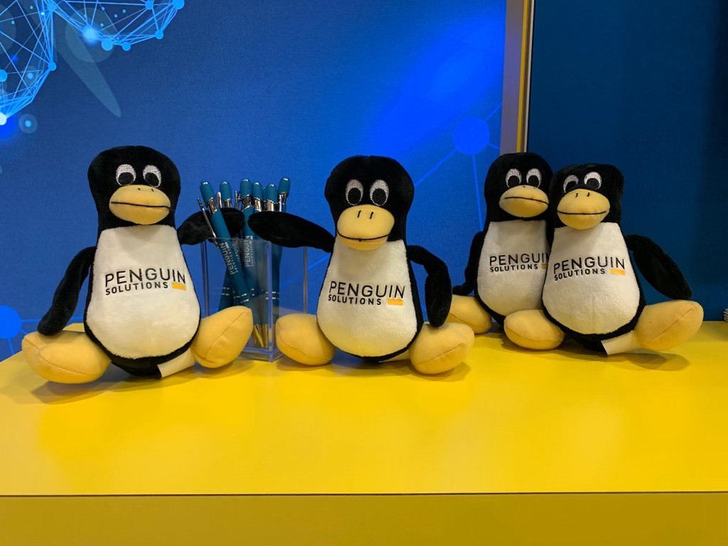Penguin Solutions plush toys and pens.